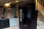 Kitchen installed with aga fridge freezer and wine storage fridge